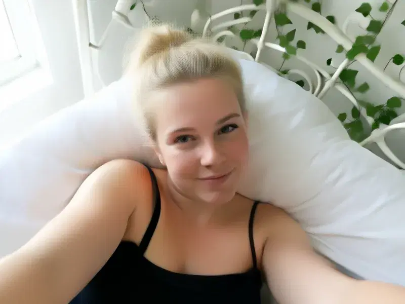 Real FLUX.2 Klein 9B generation: POV selfie of a 22-year-old white woman with fair skin, freckles, and blonde hair tied in 