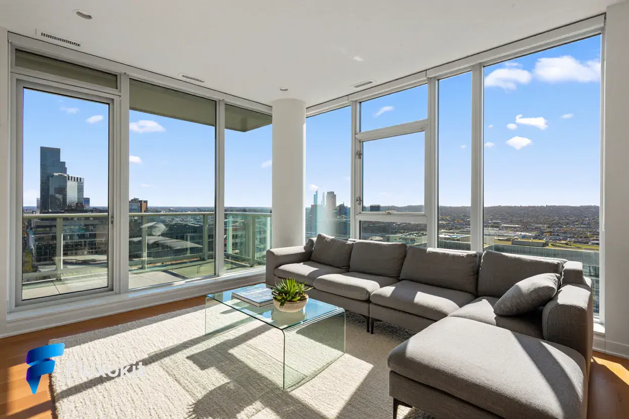 Real Reve Criar generation: Architectural interior of a bright modern living room with floor-to-ceiling windows and a 