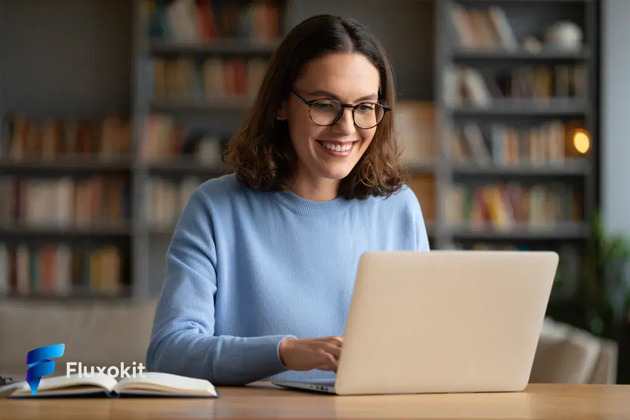 Real Reve Criar generation: A friendly educator smiling at a laptop in a warm home office, soft bokeh bookshelf, appro