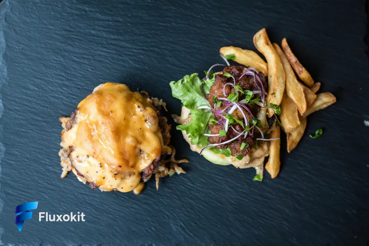 Real Reve Remix generation: Overhead flat-lay of an artisan smash burger with melted cheese and rustic fries on slate,