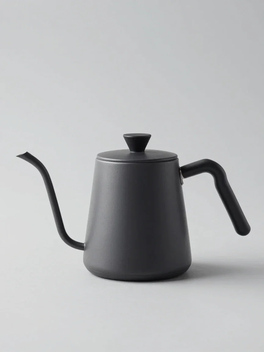 The original product photo: a matte ceramic kettle on a plain light gray studio background, generated on FluxoKit
