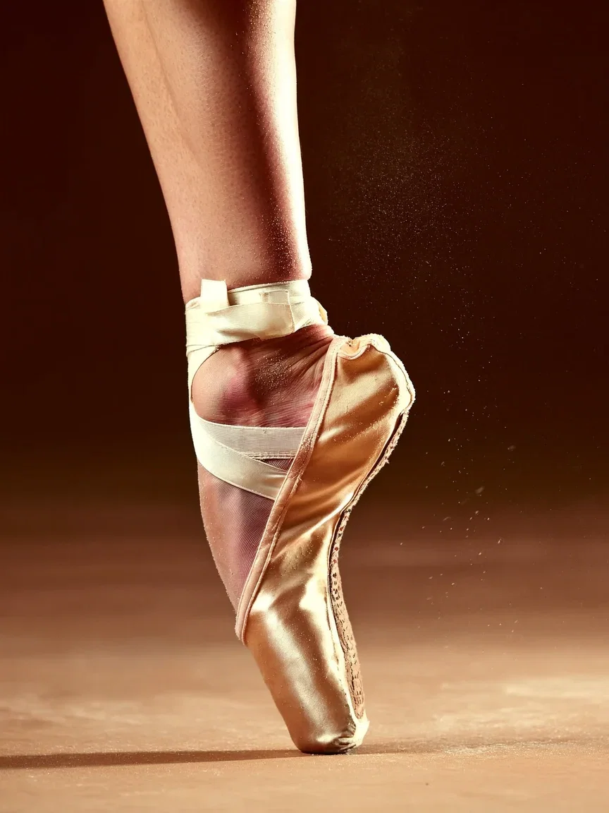 Close-up of a ballerina tying a pointe shoe in warm chalk-dust light, generated with Higgsfield Soul on FluxoKit