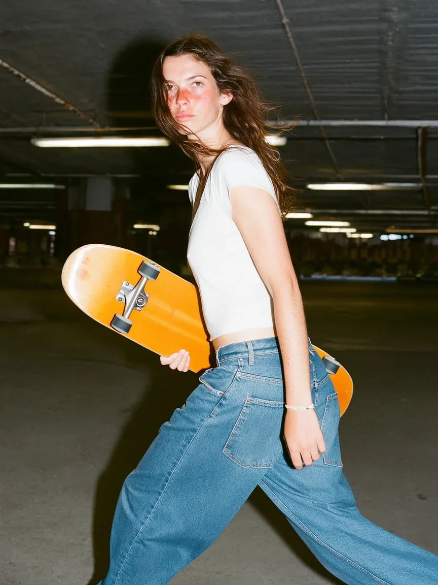 Woman carrying a skateboard through a sun-flared parking garage, generated with Higgsfield Soul on FluxoKit