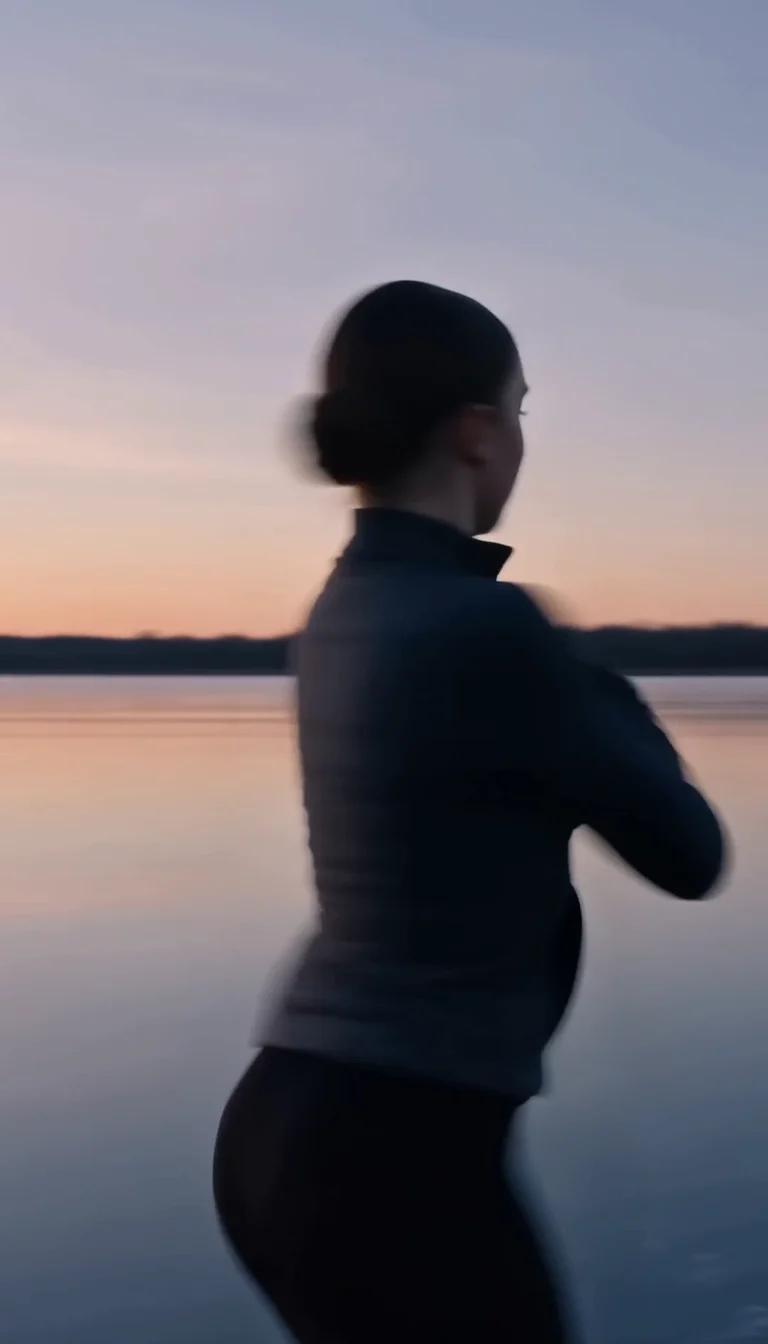 Figure skater spinning on a frozen pond at dawn in soft pink light, generated with Seedance 2.0 on FluxoKit