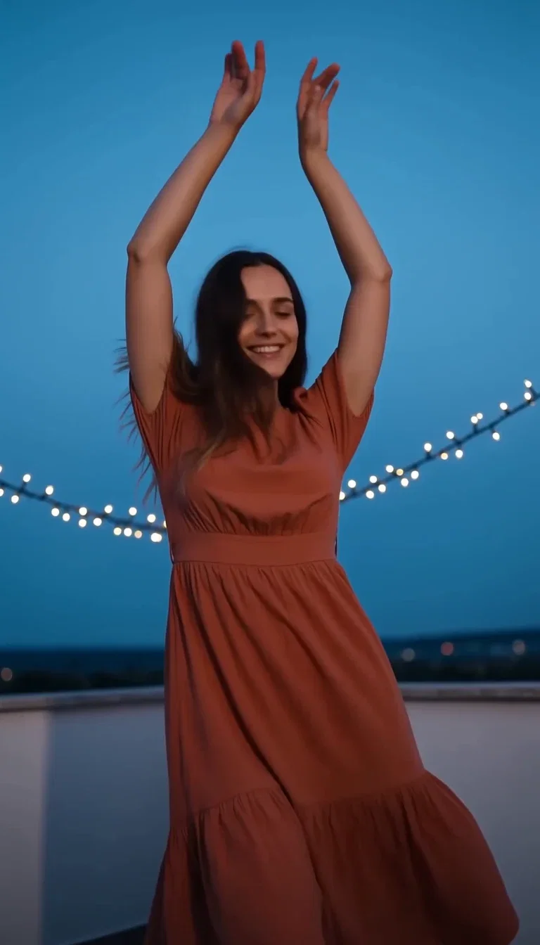 Woman in a terracotta dress twirling on a rooftop terrace at blue hour with string lights, generated with Seedance 2.0 on FluxoKit